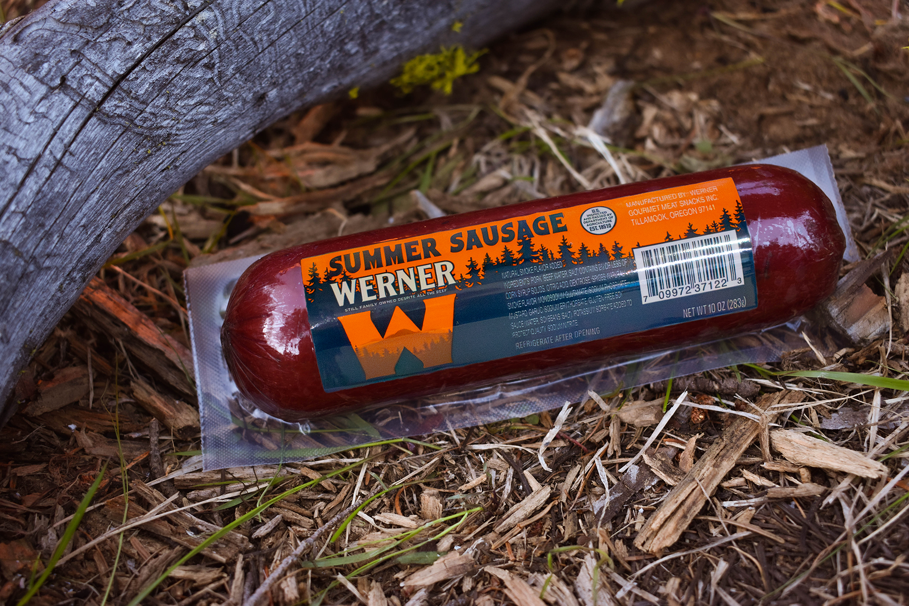 tube of summer sausage with natural backdrop