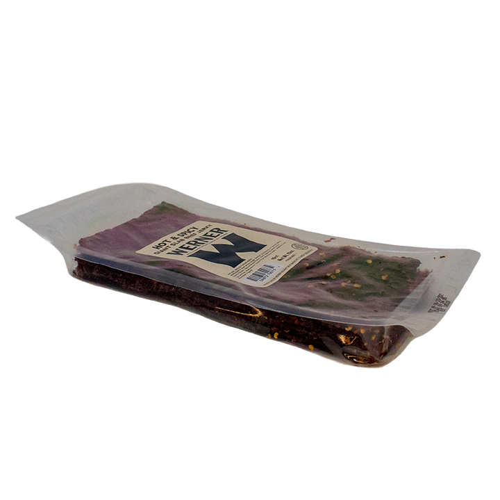 Packaged meat product with a label on a white background