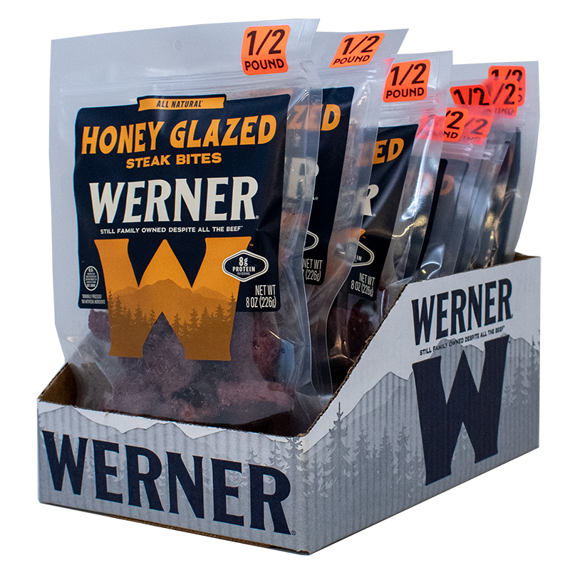 Display of Werner honey glazed steak bites packaging with clear bags and cardboard box.